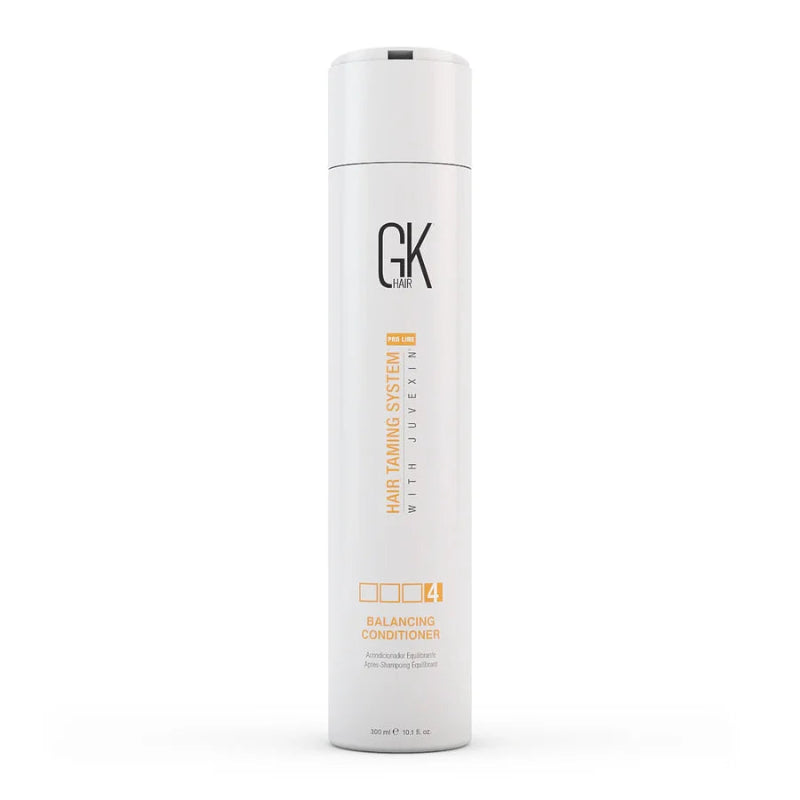A tall white cylindrical bottle of GK Cosmetics Hair Taming System 1 with Juvexin Balancing Conditioner, shown on a clean white background.