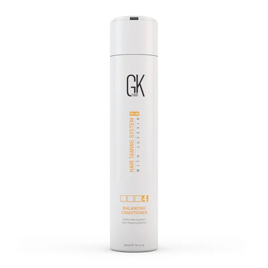 A tall white cylindrical bottle of GK Cosmetics Hair Taming System 1 with Juvexin Balancing Conditioner, shown on a clean white background.