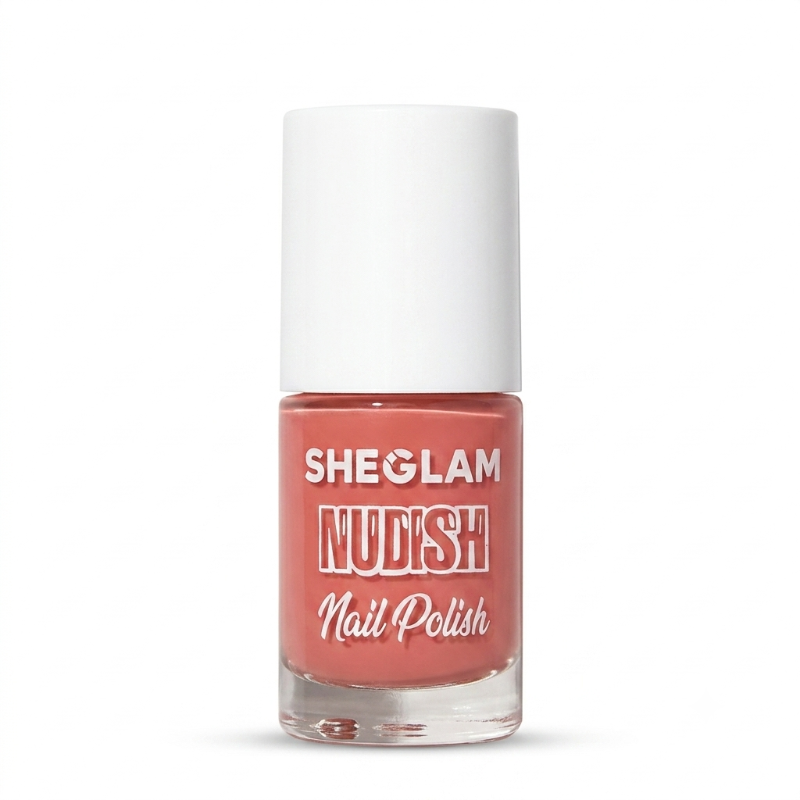 A bottle of SHEGLAM Nudish Nail Polish in a coral pink shade, featuring a white cap and clear glass bottle on a white background.