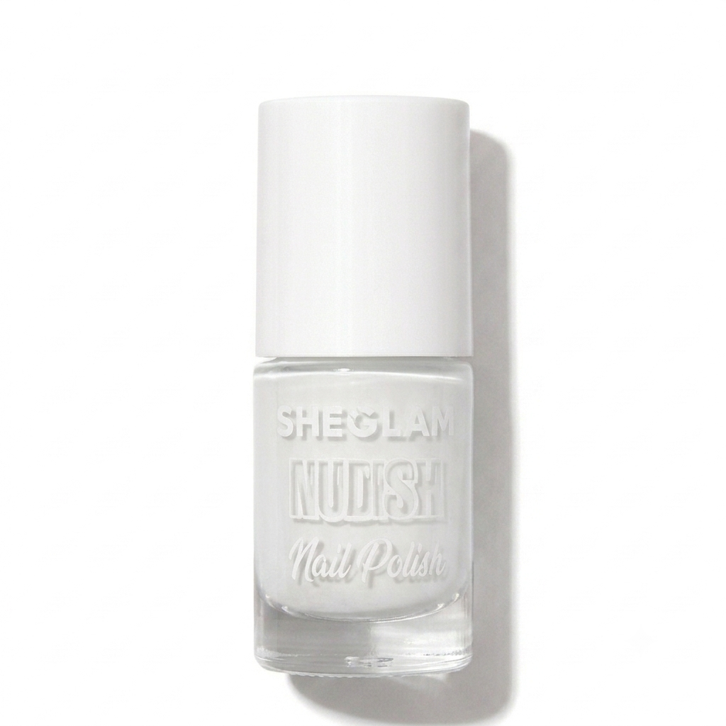 A bottle of Sheglam Nudish Nail Polish in a clear glass bottle with a white cap, showcasing a solid white nail polish, set against a plain white background with a soft shadow.