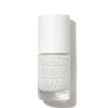 A bottle of Sheglam Nudish Nail Polish in a clear glass bottle with a white cap, showcasing a solid white nail polish, set against a plain white background with a soft shadow.